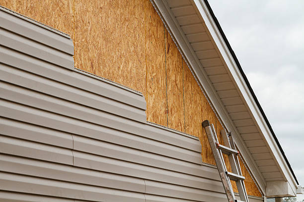 Professional Siding Repair technician working in New Paris, PA